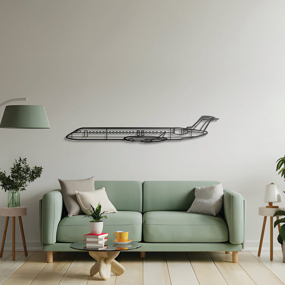 Bombardier CRJ900 silhouette in 2 mm laser-cut steel, matte powder-coat, floating mount design
