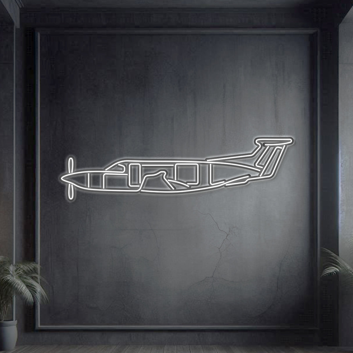 Pilatus PC‑12 single-engine turboprop neon silhouette wall art, laser‑cut steel with glowing neon outline and striking 3D elevation