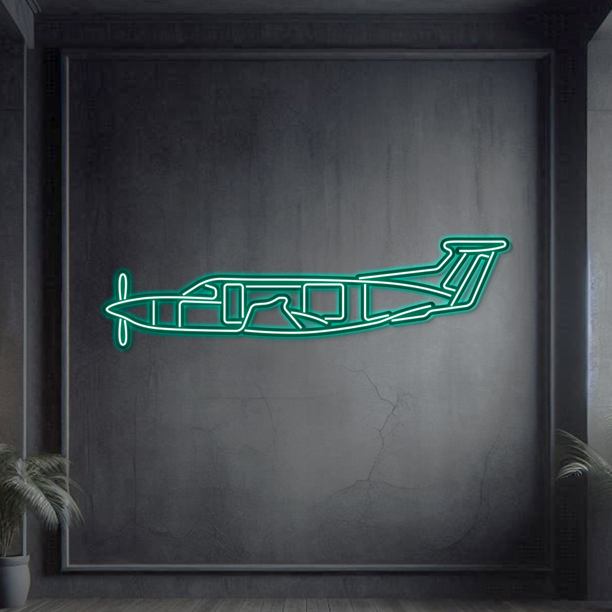 Neon-lit Pilatus PC‑12 silhouette wall art, textured matte steel with floating neon frame for impressive 3D depth