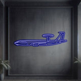 Neon‑lit E‑3 silhouette wall art, textured matte steel with floating neon frame for dramatic 3D depth