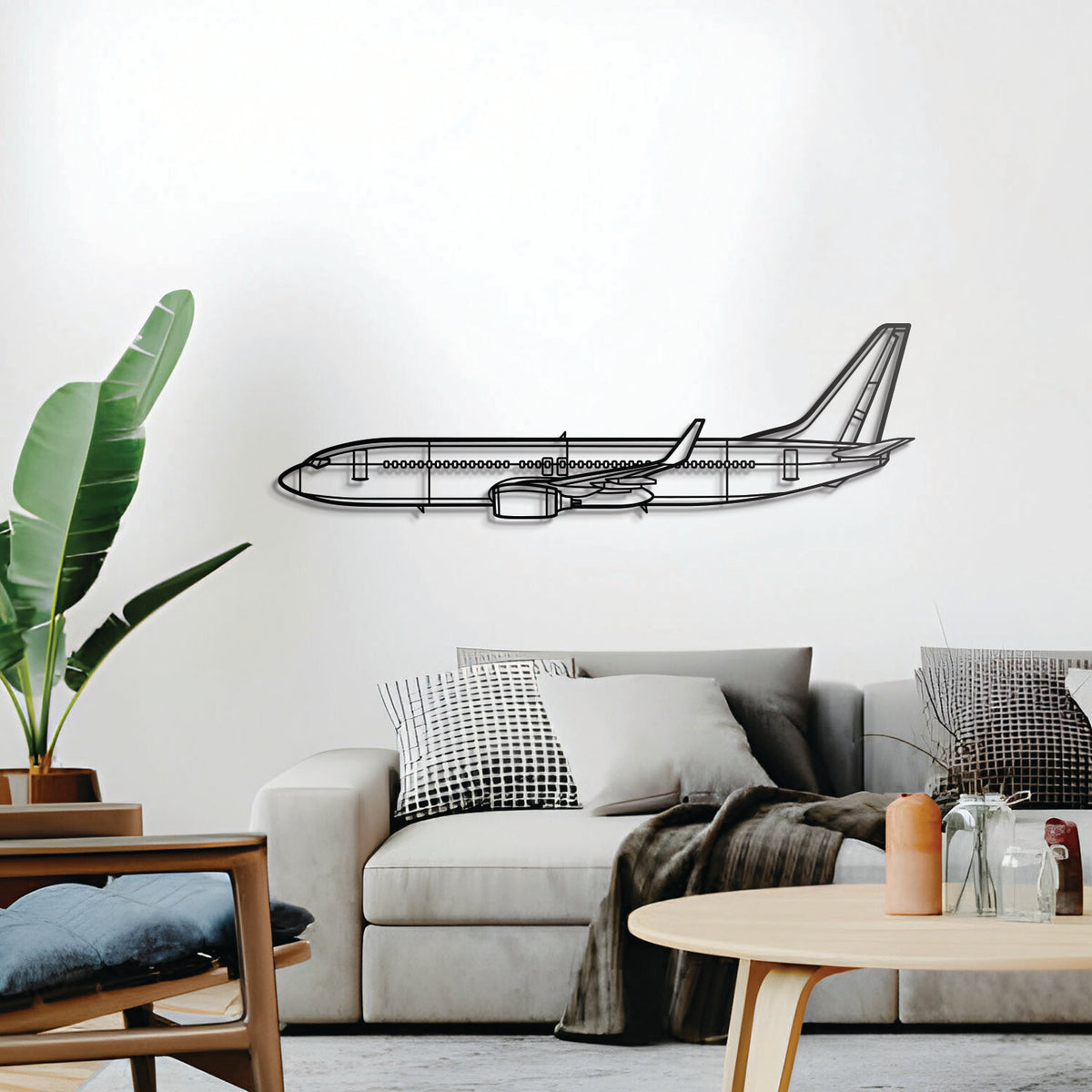Minimalist Boeing 737-800 metal silhouette — lightly elevated for a refined 3D presence