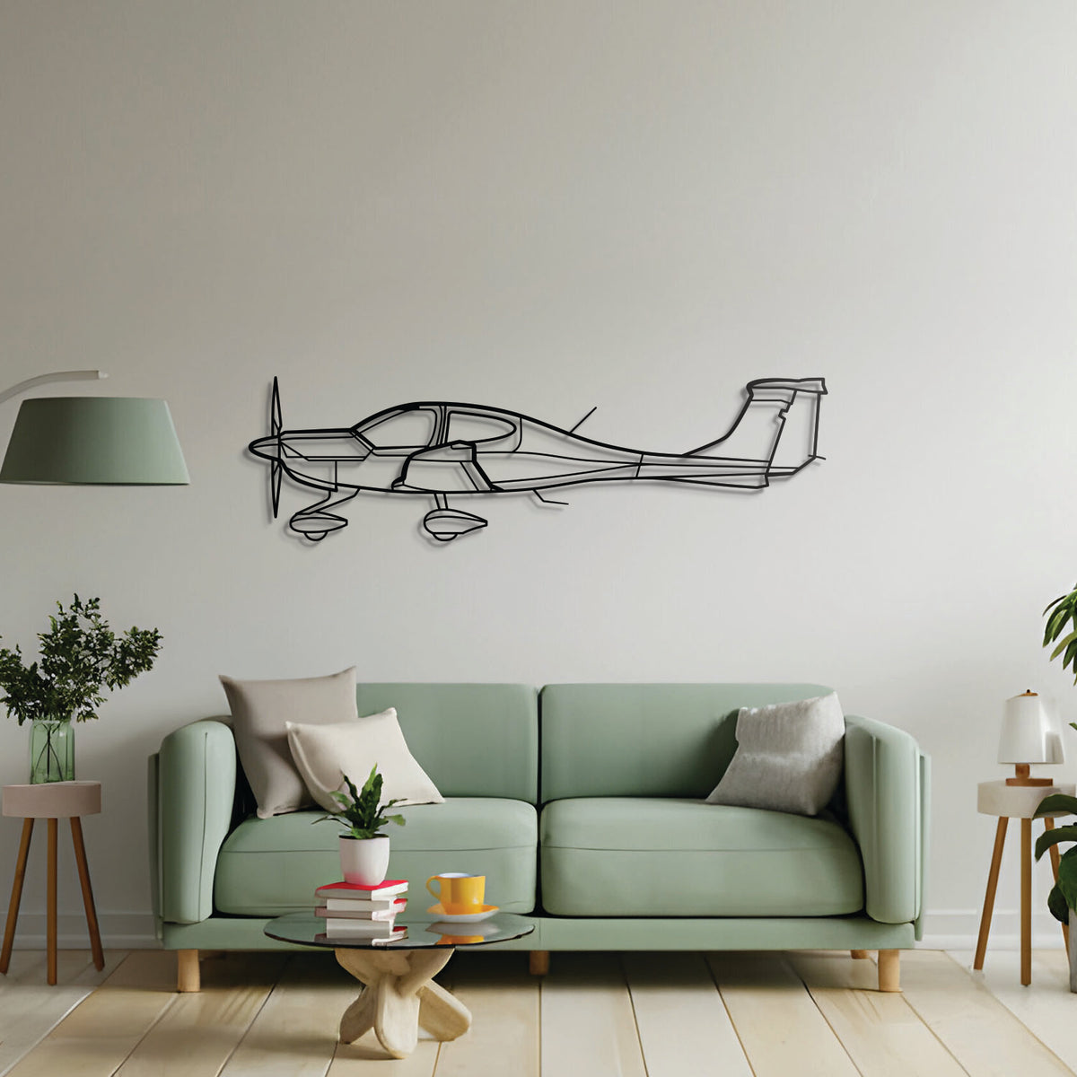 Diamond DA40 silhouette laser-cut from 2 mm textured steel, powder-coated matte black, floating mount design