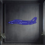 Matte black F-14 Tomcat metal wall art with vivid neon glow, premium décor for modern interiors