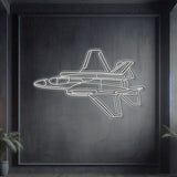 F‑35A Lightning II angle-view neon silhouette wall art, laser‑cut steel with bold neon outline and dramatic 3D elevation