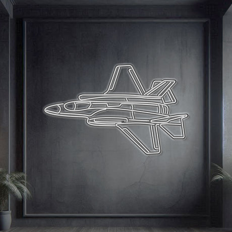 F‑35A Lightning II angle-view neon silhouette wall art, laser‑cut steel with bold neon outline and dramatic 3D elevation